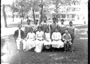 Eleven Alaskan Students with Charles E. Bunnell, 1901. Photograph courtesy of the National Anthropological Archives