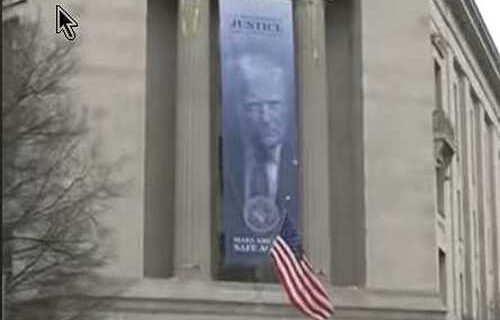 ‘An Abomination’: Enormous ‘Dictatorship-Style’ Banner With Trump Face on Side of Justice Department Decried