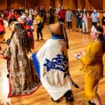 UAF photo by Leif Van Cise The Dakwakada Dancers of Haines Junction invite members of the audience on stage at the 50th Festival of Native Arts on Feb. 24, 2024.