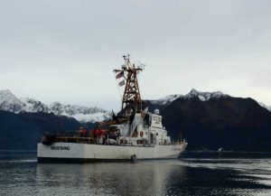 The crew of the Coast Guard Cutter Mustang transits through the calm waters of Resurrection Bay while underway for training near their homeport of Seward. (U.S. Coast Guard photo by Petty Officer 3rd Class Meredith Manning)