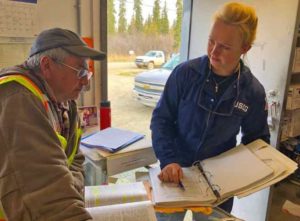 Petty Officer 3rd Class Holly Hugunin, an inspector with Coast Guard Sector Anchorage, works with Kenny Morgan, a Morgan Fuels facility manager in Kalskag, Alaska, May 16, 2019. Hugunin’s inspection was part of Sector Anchorage’s 2019 Marine Safety Task force initiative. U.S. Coast Guard photo by Lt. Cmdr. David Evans