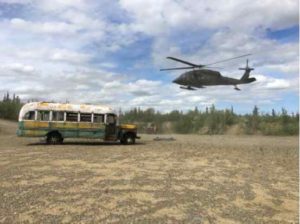 Photo courtesy of Alaska DNR Bus 142 is shown with a UH 60 Blackhawk helicopter that supported the Alaska Army National Guard operation that transported the bus from the Stampede Trail to an interim staging point on the Stampede Road.