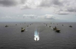 Multinational navy ships and a submarine steam in formation during a group sail off the coast of Hawaii during Exercise Rim of the Pacific. (U.S. Navy photo by Mass Communication Specialist 1st Class Rawad Madanat)