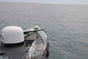 Crewmembers aboard the Coast Guard Cutter Douglas Munro fire the ship's 76mm gun while on patrol in the Pacific Ocean. U.S. Coast Guard courtesy photo.