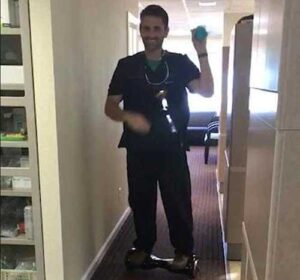 Dr. Seth Lookhart is seen in a video riding a hoverboard while performing a dental procedure.(Source: Alaska Court System)