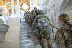 U.S. Airmen and Soldiers with the Alaska National Guard climb the stairs inside the Library of Congress in Washington, D.C., (U.S. Army National Guard photo by Sgt. Mike Risinger)