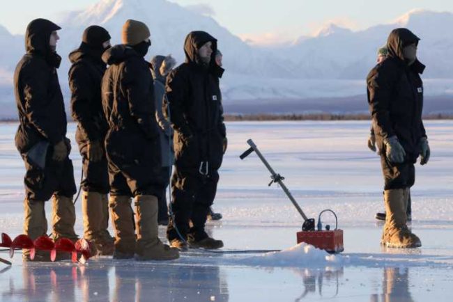 Paratroopers with 6th Brigade Engineer Battalion, 4th Infantry Brigade Combat Team (Airborne), 25th Infantry Division, use ground penetrating radar to check the thicknes of ice as they prepare to construct a bridge across the Tanana river at Donnelley Training Area, Alaska, Jan., 21, 2021. (U.S. Army photograph by Staff Sgt. Alex Skripnichuk)