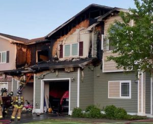 A fire started in a trash can adjacent to a housing unit on Fort Wainwright last night, causing the temporary displacement of the residents in the unit and the one adjacent. (Photo by Fort Wainwright Fire Department)