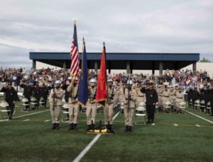The Alaska Military Youth Academy color guard team presents the colors while the national anthem plays during AMYA's graduation ceremony. (U.S Army National Guard photo by Victoria Granado)