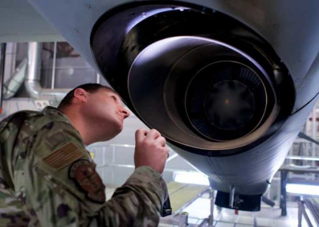 JOINT BASE ELMENDORF-RICHARDSON, Alaska – Alaska Air National Guard Airman 1st Class Brad Payton, an HC-130J Combat King II crew chief with 176th Aircraft Maintenance Squadron, inspects a 211th RQS HC-130 engine exhaust Oct. 4, 2021, at Joint Base Elmendorf-Richardson, Alaska. Payton recently completed Mission-Essential Skills Training following technical school and is pursuing a civilian career in aviation maintenance. (U.S. Air National Guard photo by David Bedard/Released)