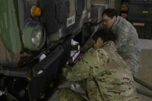 U.S. Alaska Air and Army National Guard members Airman 1st Class John Villa and Specialist Matthew Ogawa prepare the arctic all-terrain small unit support vehicle in support of the Alaska State Emergency Operations Center. Photo by Senior Master Sgt. Julie Avey 168th Wing Public Affairs