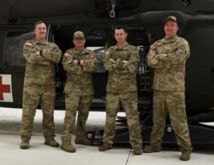 Alaska Army National Guard Chief Warrant Officer 2 Bradley Jorgensen, Sgt. 1st Class Damion Minchaca, Capt. Cody McKinney, and Staff Sgt. Sonny Cooper, all members of Golf Company, 2-211th General Support Aviation Battalion. (U.S. Army National Guard photo by Spc. Grace Nechanicky)