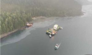 Western Mariner, an 83-foot inspected tug, ran aground in Neva Strait March, 21, 2022, while towing Chichagof Provider, a 286-foot containerized barge. No injuries were reported, and all fuel manifolds on board the tug were secured to isolate the ruptured tank. Fuel offload efforts have commenced. A Unified Command comprised of the Coast Guard, Alaska Department of Environmental Conservation, and Western Towboat has been established. U.S. Coast Guard photo by Petty Officer 1st Class Brian Wereda.