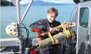 M.S. Student James Currie with a SeaFET sensor. Photo credit: James Currie