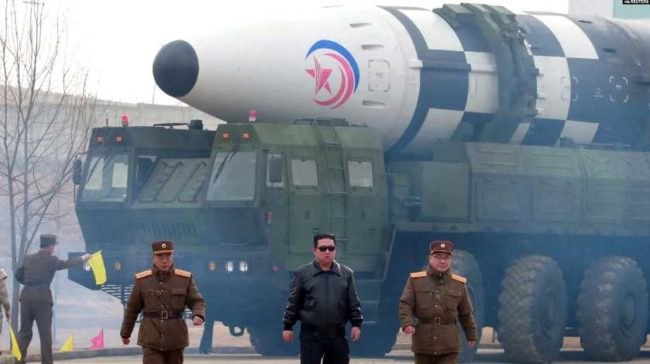 North Korean leader Kim Jong Un walks away from what state media report is a 'new type' of intercontinental ballistic missile (ICBM) in this undated photo released on March 24, 2022, by North Korea's Korean Central News Agency (KCNA).