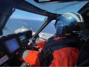 Coast Guard Lt. Cmdr. Eric Kolwicz, an Air Station Kodiak pilot, flies above the Alaska ferry Kennicott in Shelikof Strait. U.S. Coast Guard imagery courtesy of Lt. Scott Kellerman