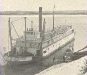 The Cutter Nunivak berthed on the Yukon River.