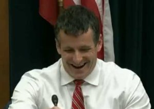 Republican Rep. Trey Hollingsworth laughing after boasting that one of his staff is moving to a position within the Bank of America. Image-C-Span video screengrab.