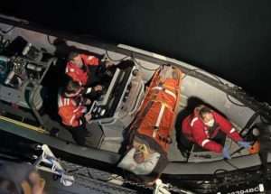 The crew of U.S. Coast Guard Cutter John McCormick medevacs an injured fisherman. U.S. Coast Guard photo courtesy of Cutter John McCormick