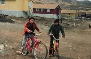 Photo: Karluk boys on bicycles. Courtesy of the Rostad Collection.