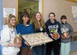 Photo: Student bakers in Port Lions. Photograph courtesy of Sara Squartsoff.