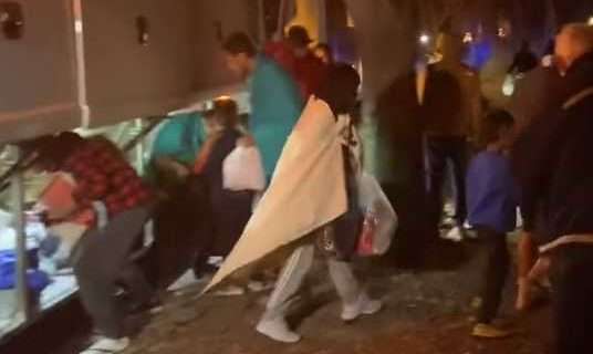 Abbott Blasted for ‘Cruel Stunt’ as Migrants Bussed to Kamala Harris’ Home on Christmas Eve