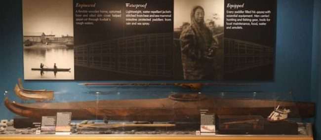 Historic kayak and other artifacts on display at the Alutiiq Museum