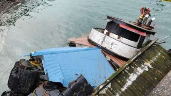 Coast Guard Sector Juneau and contractors respond to partially-submerged tug in Juneau