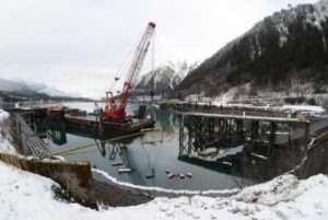 The Tagish, a 107-foot tugboat, built during World War II, is submerged at the Gastineau Channel dock in Juneau, Alaska, Feb. 9, 2023. (U.S. Coast Guard photo by Petty Officer 3rd Class Ilian Borrero-Aguirre)