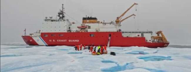 A U.S. Coast Guard Cutter Healy (WAGB 20) station keeps alongside a multi-year ice floe while a team of crew and researchers install equipment in the Beaufort Sea. (Coast Guard photo by Petty Officer 3rd Class Briana Carter)
