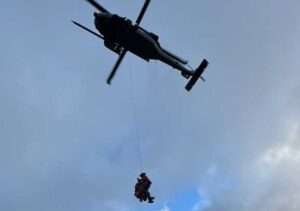 U.S. Air Force Staff Sgt. Nathan Weltman, a pararescueman with 57th Rescue Squadron, Aviano Air Base, Italy, hoists a stranded sheep hunter into a 210th Rescue Squadron HH-60G Pave Hawk. Courtesy photo