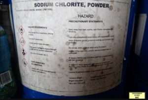 A bucket of Sodium Chlorite was submitted as evidence. Image-DOJ