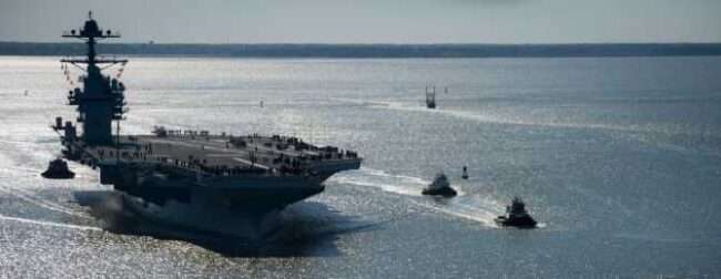 FILE - In this photo provided by the U.S. Navy, the USS Gerald R. Ford embarks on its first sea trial from Newport News, Virginia, April 8, 2017. (Mass Communication Specialist 2nd Class Ridge Leoni/U.S. Navy)