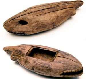 Photo: Wooden box carved in the shape of a fish, perhaps to hold talismans. Karluk One Site, ca. 400 years old, Koniag, Inc. Collection. AM193.
