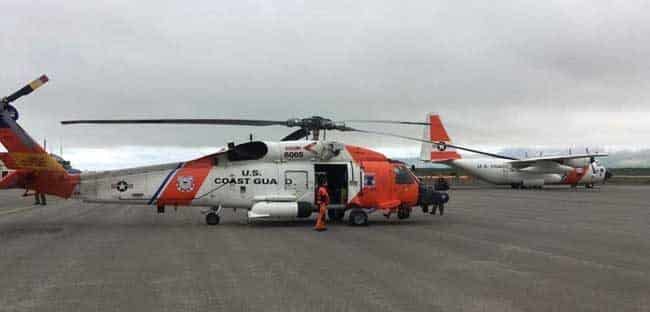 A Coast Guard Air Station Kodiak MH-60 Jayhawk aircrew swaps with another Jayhawk aircrew in Cold Bay, Alaska, to conduct a long-range medevac 190 miles west of Dutch Harbor, Alaska, Aug. 6, 2018. An HC-130 Hercules aircrew assisted by providing a communications platform and transporting the extra Jayhawk aircrew. U.S. Coast Guard photo by Lt. Jeff Mistrick.