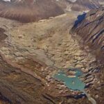 A new glacial lake is starting to form as the Kuskulana Glacier retreats on the south side of Mount Blackburn in the Wrangell Mountains of Alaska. Photo by Louis Sass