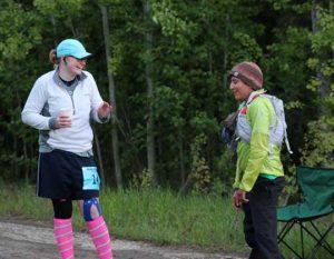 Laura Southwell of Anchorage and Carmen Klooster of Fairbanks take a break after completing a six-mile lap in the Alaska Endurance Trail Run, held on the UAF campus. Photo by Chris Carlson.