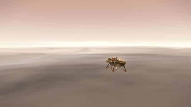 This illustration shows a simulated view of NASA's Interior Exploration using Seismic Investigations, Geodesy and Heat Transport (InSight) lander firing retrorockets to slow down as it descends toward the surface of Mars. Credits: NASA/JPL-Caltech