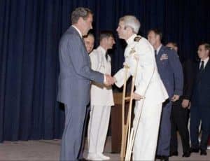 Lieutenant Commander McCain greeting President Richard Nixon in May 1973. Image-White House Photo Office Collection