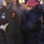 People mourn at a makeshift memorial in the area where 37-year-old Alex Pretti was shot dead by federal immigration agents earlier in the day in Minneapolis, Minnesota, on January 24, 2026. (Photo by Roberto Schmidt)