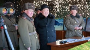 Undated photo released by North Korea's official Korean Central News Agency (KCNA) on Feb. 21, 2016 shows North Korean leader Kim Jong-Un (C) inspecting maneuvers for attack and defense between large combined units of the Korean People's Army (KPA).