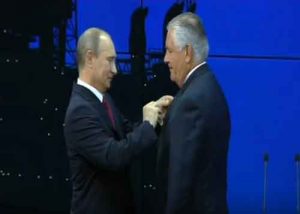 Trump's Secretary of State pick, Rex Tillerson, receiving medal from Russian President Vladimir Putin. Image-Screengrab Exxon Mobile video