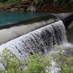 Photo by Amanda Byrd/ACEP Water flows over Cordova Electric Cooperative’s Power Creek dam, part of a run-of-the-river hydroelectric system that uses an inflatable, adjustable barrier to divert water into the power generating plant.