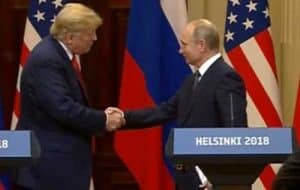 Trump and Putin shaking hands at press conference in Helsinki.