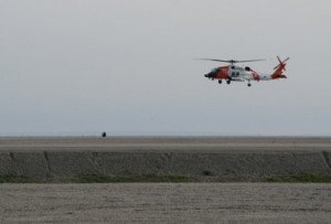 A Coast Guard MH-60 Jayhawk helicopter from Air Station Kodiak, Alaska, takes off in Prudhoe Bay, June 27, 2015. An aircrew from the air station was deployed to Prudhoe Bay to conduct maritime domain awareness flights. (U.S. Coast Guard photo by Petty Officer 3rd Class Meredith Manning)