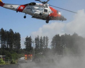 The crew of an Air Station Kodiak MH-60 Jayhawk helicopter and Kodiak Fire Department personnel depart after completing a medevac of an injured woman in Kodiak, Alaska, Aug. 1, 2014.