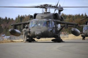 Alaska National Guardsman, Sgt. Brianna McMillen, waits outside of a UH-60 Black Hawk as it prepares to move exercise patients and equipment during Operation Rock and a Hard Place in Homer, Alaska, March 21, 2015. Off duty, McMillen is Alaska’s only female competitive breakdancer. (U.S. Army National Guard photo by Staff Sgt. Balinda O’Neal Dresel)