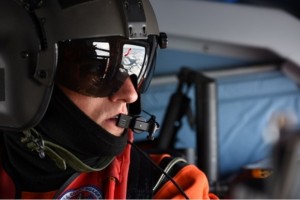 Petty Officer 2nd Class Darren Hicks, an aviation survival technician at Coast Guard Air Station Kodiak, looks out over Arctic sea ice during a search and rescue exercise near Oliktok Point, Alaska, July 13, 2015. (U.S. Coast Guard photo by Petty Officer 2nd Class Grant DeVuyst)