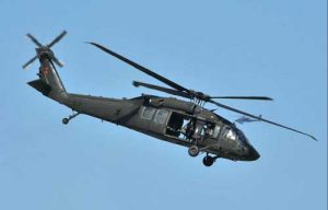 A U.S. Army UH-60 Blackhawk helicopter, similar to the one pictured here crashed into the sea two miles west of Kaena Point, Oahu with five crew aboard. Image U.S. Army