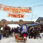 This Day in Alaska History-March 20th, 1985 Libby Riddles crossing the Nome finish line in 1985. Image-Alaska Sports Hall